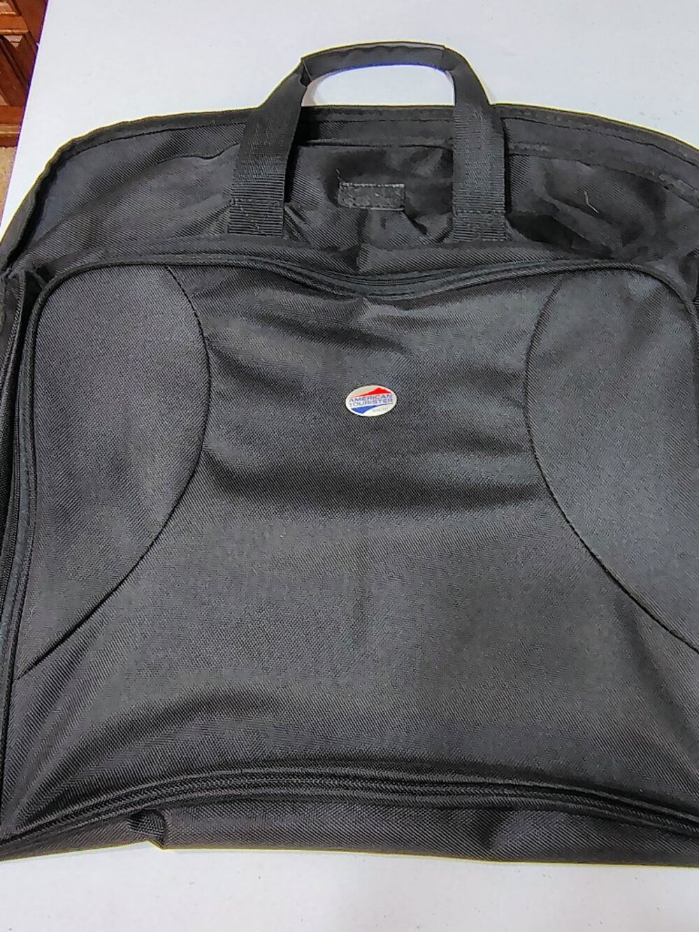 AMERICAN TOURESTER BLACK CANVAS GARMENT TRAVEL BAY. DEC. 2009 EDITION